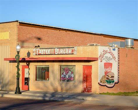 Tastee Burger restaurant building with a red awning